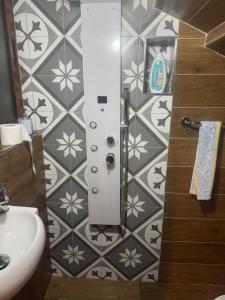 a bathroom with a sink and a shower stall at rabat apartment in Rabat