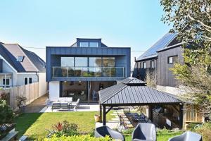 a house with a gazebo in a yard at Xanadune Beach House by Bloom Stays in Greatstone