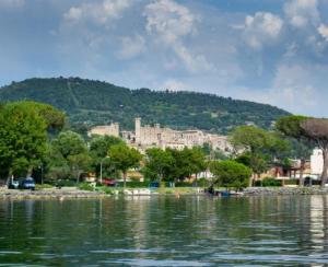 a large body of water with a city in the background at Casa Margherita in Bolsena