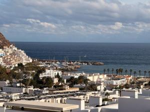 a view of a city with the ocean and buildings at Casa Almar in San José