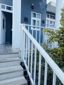 a stairway leading up to a house at Naadee villa in Ekala