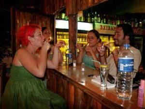 a group of people sitting at a bar at Bayrams Tree Houses in Olympos