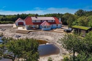 an aerial view of a house on the beach at 266-Harboore-Strandvejen-177-A in Harboør