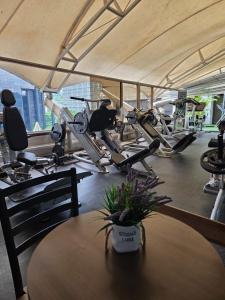 a gym with several exercise bikes and a table at Hotel CCT Caracas in Caracas