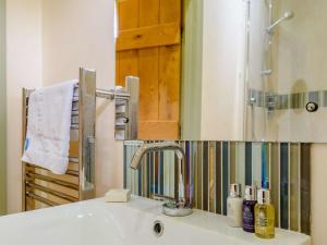 a bathroom with a sink and a mirror at 2 Bed in Newark oc-88427 in Walesby +6 photos