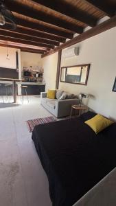 a bedroom with a bed and a living room at Florida Private loft, shared garden pool in Florida