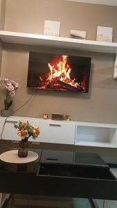 a living room with a fire in the wall at Manila Bay City Lights in Manila