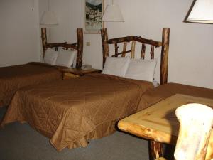 Postel nebo postele na pokoji v ubytování Georgetown Mountain Inn