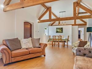 a living room with a couch and a dining room at 3 Bed in Ashbourne oc-94309 in Windley