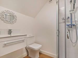 a white bathroom with a toilet and a shower at 3 Bed in Ashbourne oc-94309 in Windley +17 photos