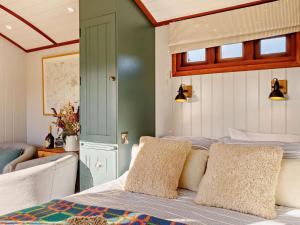 a bedroom with a bed with two pillows on it at 1 Bed in Lutterworth oc-93760 in Boughton