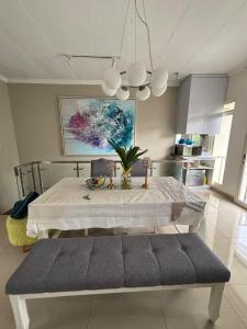 a kitchen with a table in a room with a table sidx sidx sidx at Gyuzel villa di lembang in Citeureup 1 +28 photos