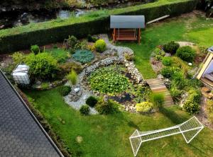 an aerial view of a garden with a bench at Country House Liptov in Svätý Kríž