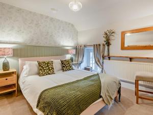 a bedroom with a large bed and a window at 2 Bed in Buxton oc-95993 in Hartington