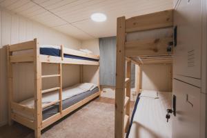 a bunk bed room with two bunk beds in it at NORD Apartment in Tromsø