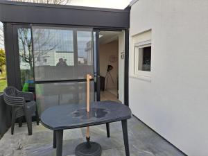 a small table with a candle on a patio at Maison de vacances Etoile de mer 2 in Koksijde