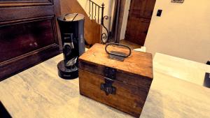 a wooden box sitting on top of a counter at Le Puits Enchanté in Espalion