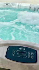 a close up of a bath tub with blue water at Ada&niní in Galatina