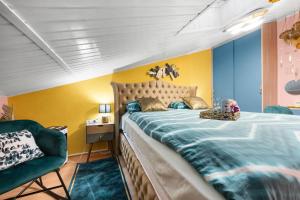 a bedroom with a large bed and a chair at Vila Andja in Banjole,Istrien by Istrabook in Banjole +51 photos
