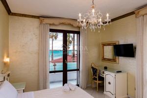 a bedroom in a villa with a view of the ocean at DIO DEL MARE LUXURY ROOM in Porto Cesareo