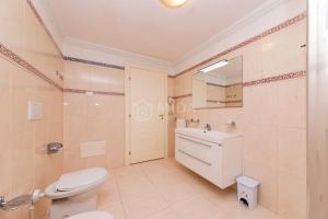 a bathroom with a toilet sink and a mirror at DIO DEL MARE LUXURY ROOM in Porto Cesareo