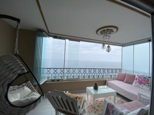 a room with a hammock in a room with a window at Trabzon Sea Pearl in Trabzon