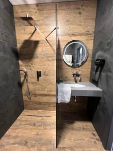 a bathroom with a sink and a mirror at Amaro Hotel Uman in Uman