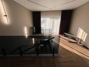 a living room with a glass table and a couch at Amaro Hotel Uman in Uman +51 photos