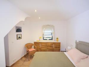 a bedroom with a bed and a mirror at Apartment at Cadaqués Church in Cadaqués