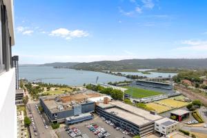 an aerial view of a building with a parking lot at 2BDR Luxury Apartment Panoramic Views in Gosford