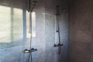 a shower with a glass door in a bathroom at Stay North - Kajastus in Salo +23 photos