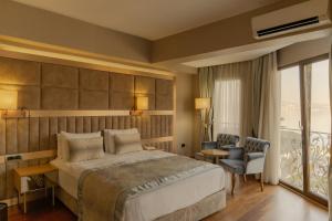 a hotel room with a bed and a balcony at Lale Boutique Hotel in Sapanca +24 photos