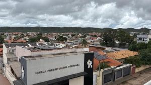a view of a city with roofs and buildings at Studio Moderno e Aconchegante , Centro Unai in Unaí +5 photos