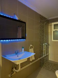 a bathroom with a sink and a shower at Villa Palm Desert- your Private Stay with AC, Fast WiFi & Parking in Erfoud +61 photos
