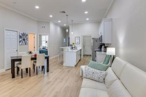 a living room and kitchen with a couch and a table at Pool Access + Course View: Golf Getaway in Sebring in Sebring