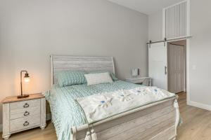 a bedroom with a bed and a dresser and a lamp at Pool Access + Course View: Golf Getaway in Sebring in Sebring +19 photos