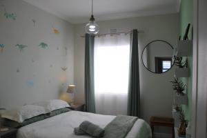 a bedroom with a bed and a mirror and a window at Logans Place in Oakdale +33 photos