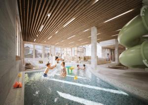 a group of children playing in a swimming pool at Gorfion Familienhotel in Malbun