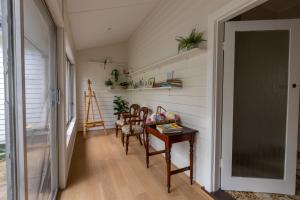 a hallway with a table and chairs in a house at Nan's House in Mansfield
