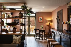 a kitchen and dining room with a table and chairs at The Mistley Thorn in Mistley