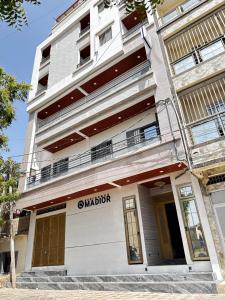 an apartment building with a balcony on the side of it at Résidence Madior C3 in Dakar