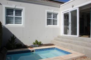 a house with a swimming pool in front of it at Logans Place in Oakdale