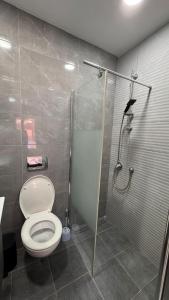 a bathroom with a toilet and a shower at Eilat Room in Eilat