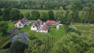 an aerial view of a house with a yard at Dielpenhof in Zedelgem
