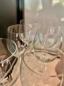 four empty wine glasses sitting on a table at Royal Shell by Utalay Koh Chang in Ban Khlong Son