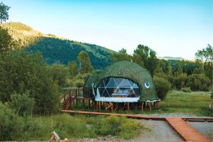 a dome shaped house on the train tracks at Tammah Jackson Hole in Wilson