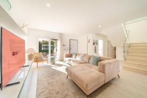 a living room with a couch and a table at GuestReady - Aroeira Pool Villa in Setúbal +36 photos