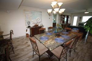 a dining room with a table and chairs at 12th Floor Penthouse Beachfront, Large Balcony, Amazing Views, 3 Pools, Tennis in South Padre Island