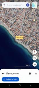 a cell phone screen with a map on it at Twins house pool 2 in Nikiti