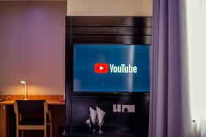 a television with the youtube logo on it at Spring Hills Group in Dodoma
